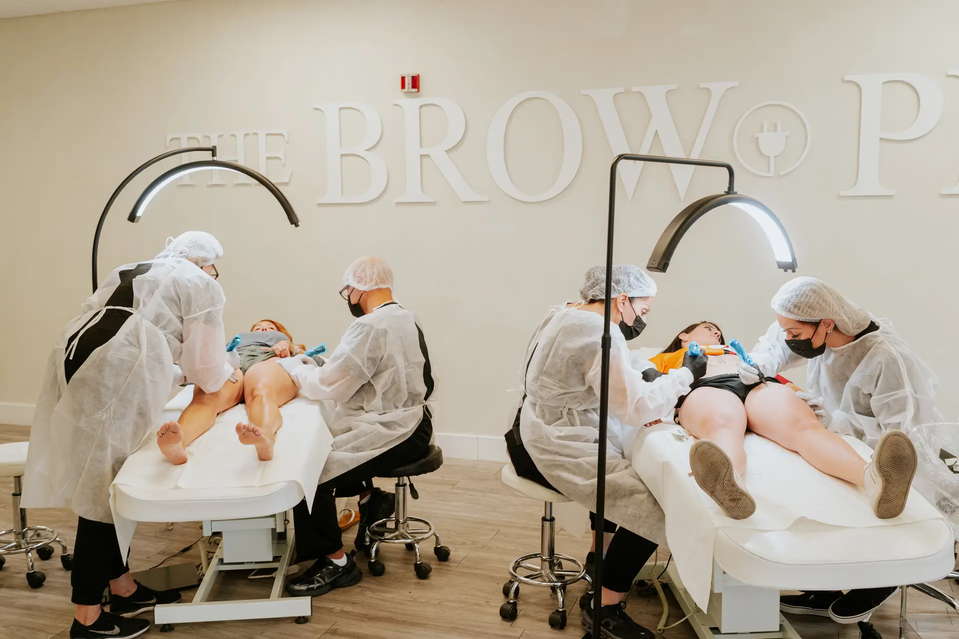 Dr. Cecilia Rusnak supervising students during hands-on Paramedical Tattoo Training on a live model at Healing Skin Medical Aesthetics.