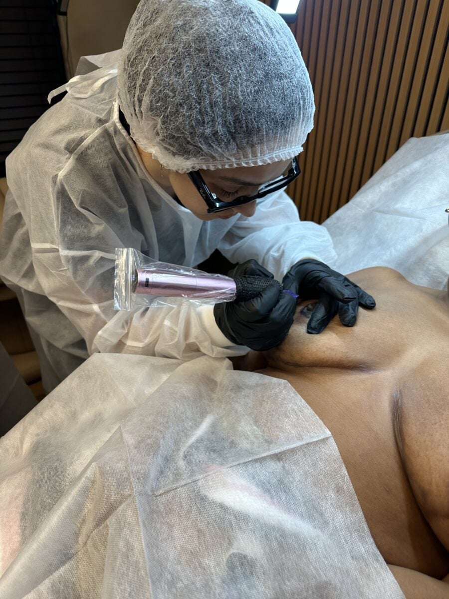Student performing 3D areola color restoration during hands-on practice at the Dr. Rusnak Academy masterclass