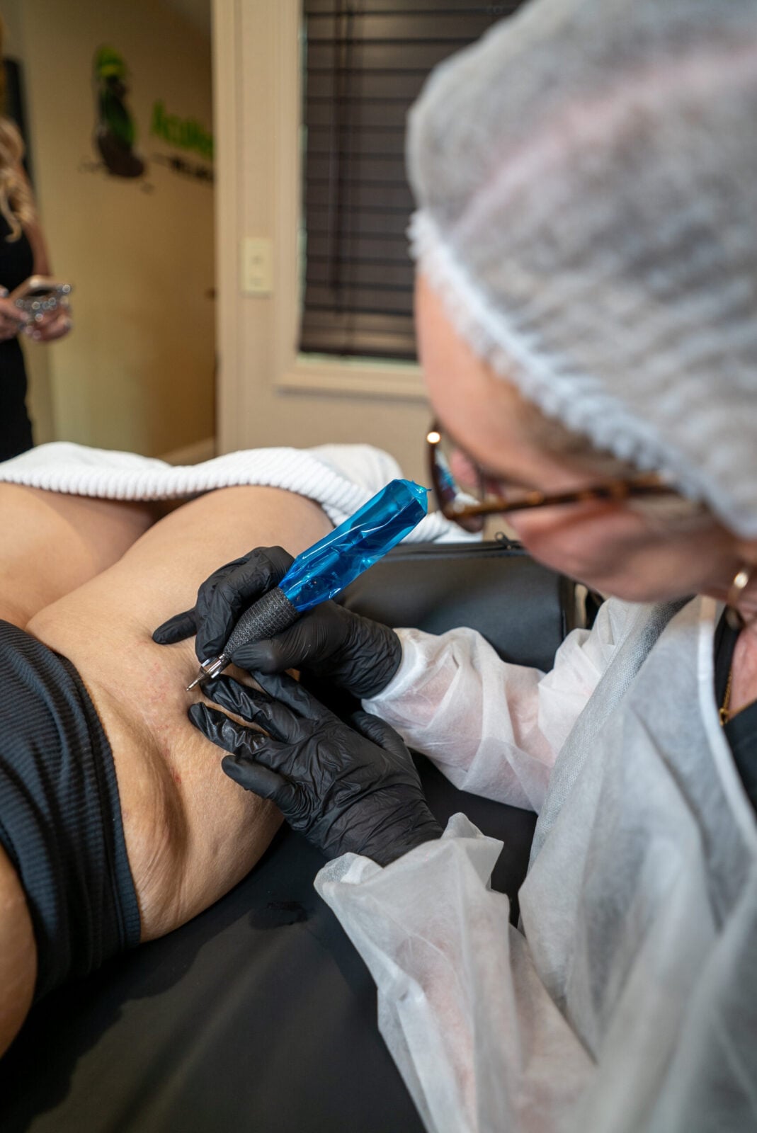 Hands-on paramedical tattoo training in progress at the in-person certification class, Dr. Rusnak Academy