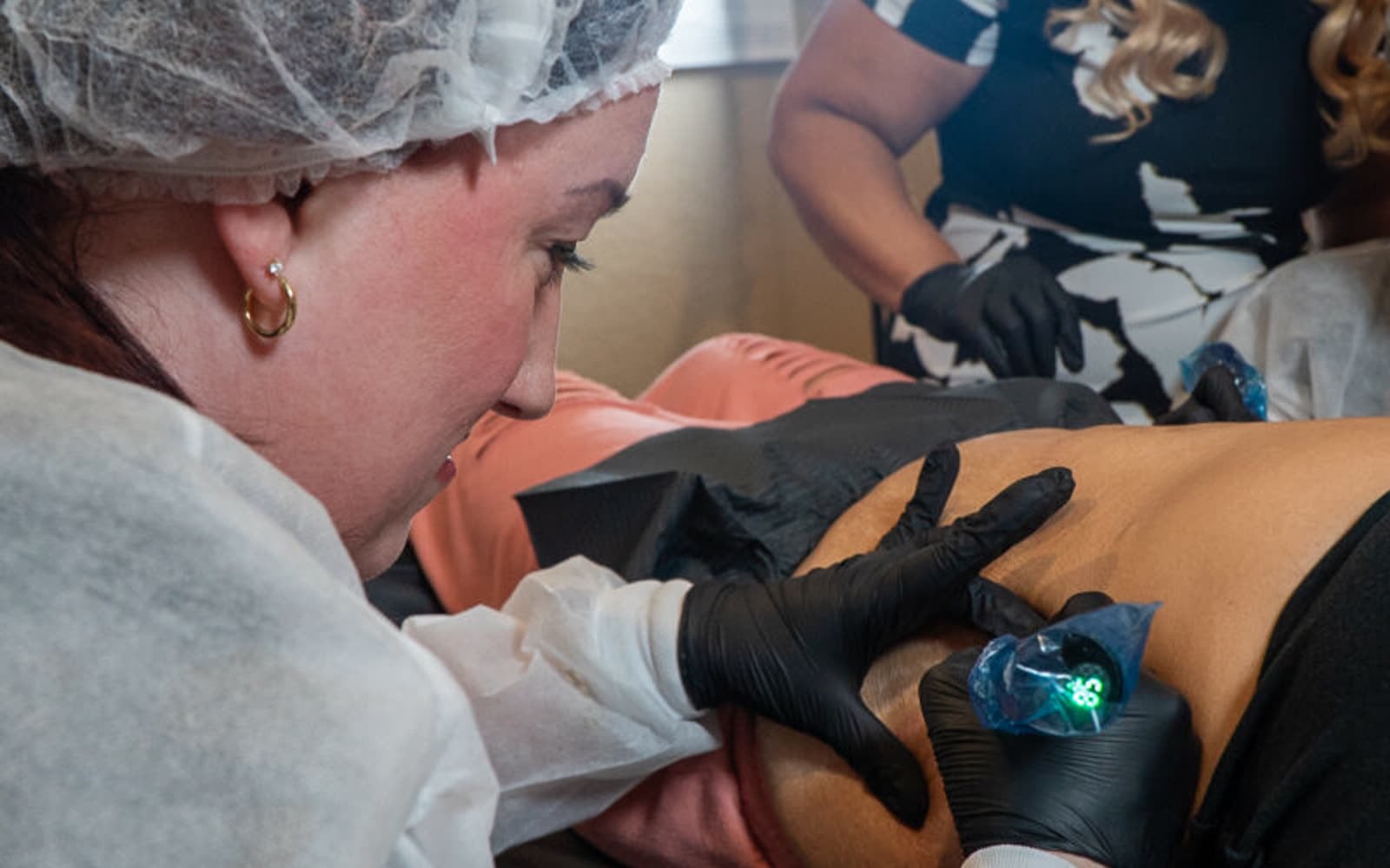 Dr. Rusnak leading a training session at Healing Skin